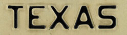 
The word 'Texas' as seen on an original Texas automotive license plate from the 1970s.